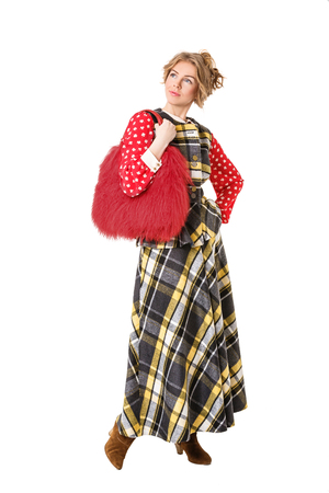 attractive beautiful blonde girl in checked dress with red fur bagの写真素材