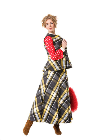 attractive beautiful blonde girl in checked dress with red fur bagの写真素材