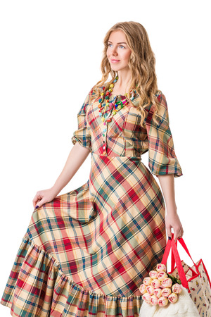 attractive beautiful blonde girl in checked dressの写真素材