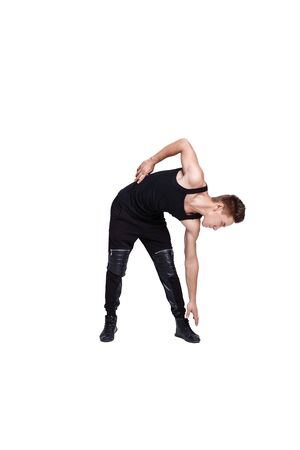attractive young man doing exercises on white backgroundの写真素材
