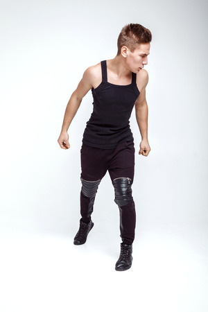 attractive young man fight on white backgroundの写真素材