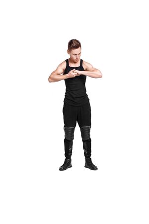 attractive young man doing exercises on white backgroundの写真素材