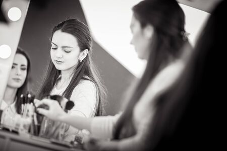 Makeup artist apply makeup to a model.の写真素材