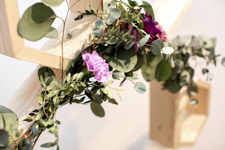 the decor of the branches of eucalyptus and pink flowersの写真素材