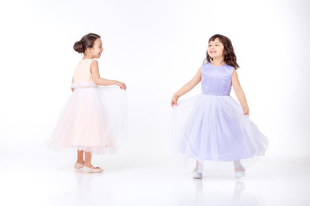 Portrait of two little girls dressed in princessの写真素材