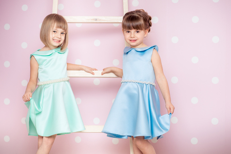 Portrait of two little girls dressed in princessの写真素材