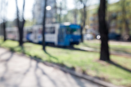 blurred urban background. the tram rides around the city. the streets of the city in the springの写真素材