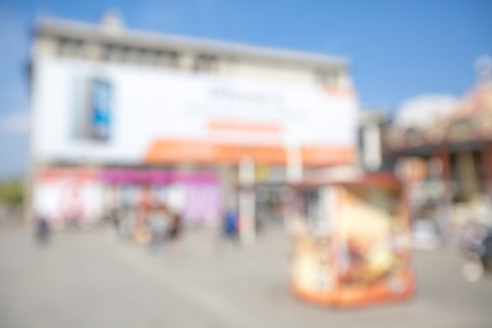 blurred background. people walking on a city street. street on a spring dayの写真素材