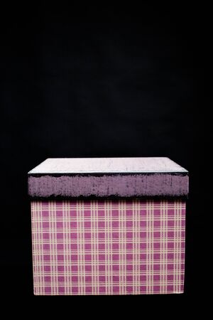 purple Christmas gift box on black background
