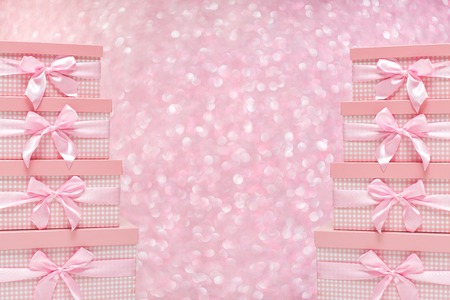 gift boxes with satin ribbons on bokeh background.の写真素材