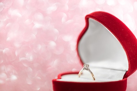 wedding diamond ring in  red heart shaped gift boxの写真素材