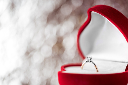 wedding diamond ring in  red heart shaped gift boxの写真素材