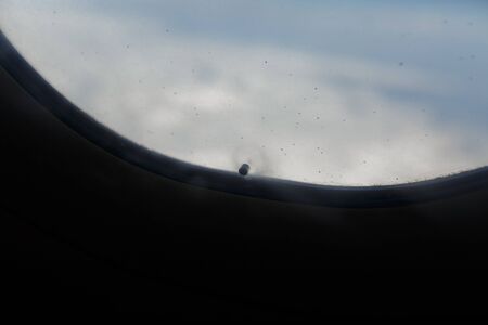 little hole in airplane windowの写真素材