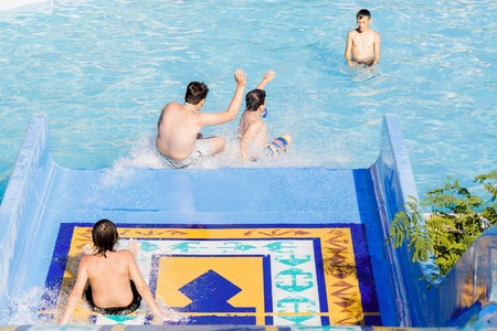 Turkey, Okurcalar - August 24, 2016: young woman going down a waのeditorial素材