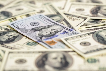 cash money close up. one new and pile of old hundred dollar bilの写真素材