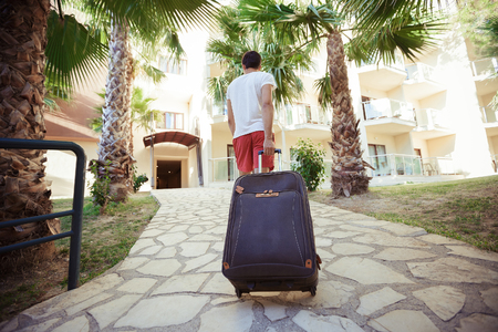 man  comes with  suitcaseの写真素材