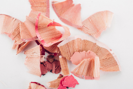 cosmetic pink pencil shavings on white backgroundの写真素材
