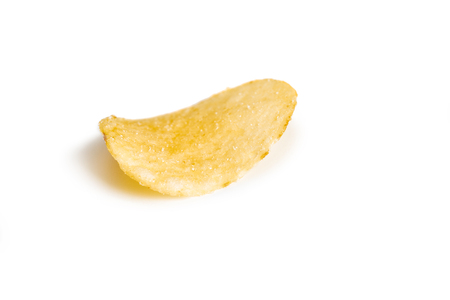 single crispy potato chip isolated on white background  close-upの写真素材