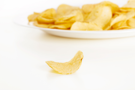 Crispy potato chips isolated on white background  close-upの写真素材