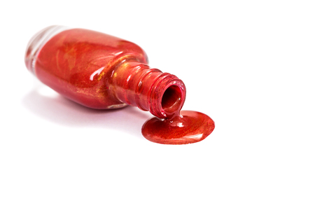 red nail Polish spilled isolated on white backgroundの写真素材