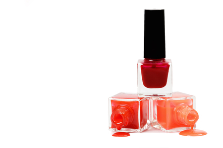 Stack of red nail polish isolated on white backgroundの写真素材