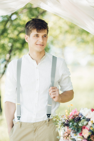 Portrait of young handsome groom outdoors. fine art photographyの写真素材