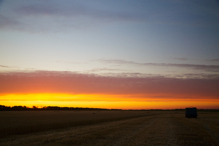 Beautiful sunset over the summer fieldの写真素材