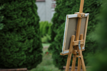 easel with canvas in garden.の写真素材