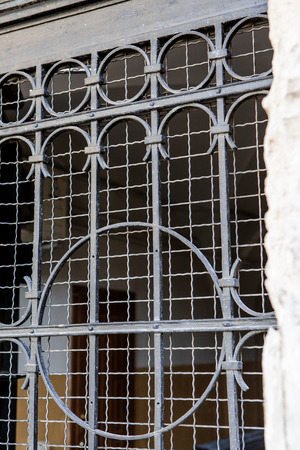 metal lattice window in the wall