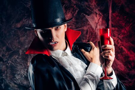 handsome man dressed in a Dracula costume for Halloween.の写真素材