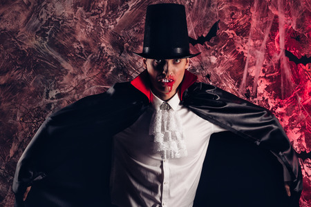 handsome man dressed in a Dracula costume for Halloween.の写真素材