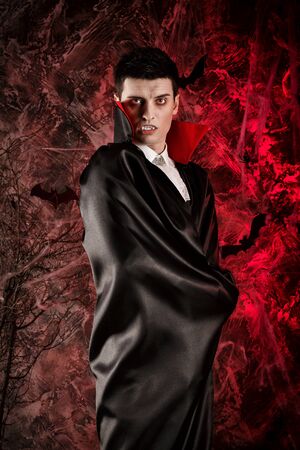 handsome man dressed in a Dracula costume for Halloween.の写真素材