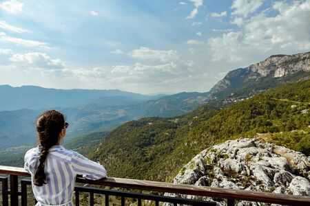 tourist looking at view of Mountains, Montenegroの写真素材