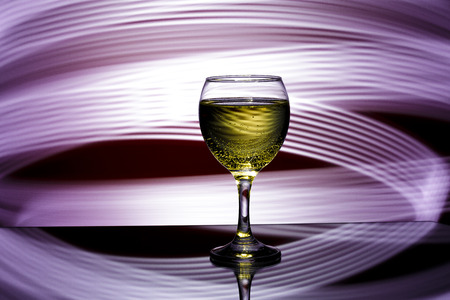 glass of champagne on  red background.の写真素材