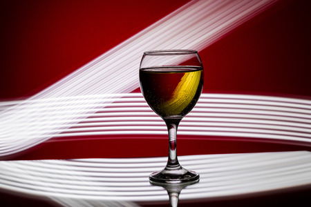 glass of champagne on  red background.の写真素材