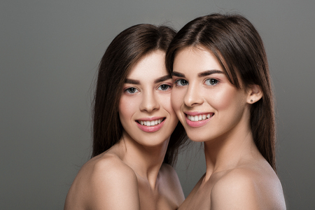 twins women with perfect skin and natural make-upの写真素材