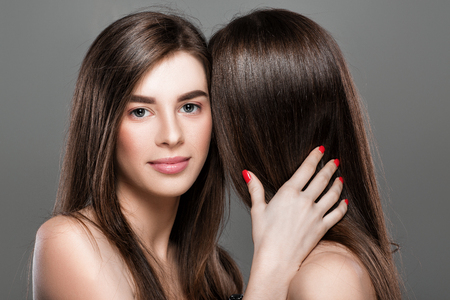 twins women with perfect skin and natural make-upの写真素材
