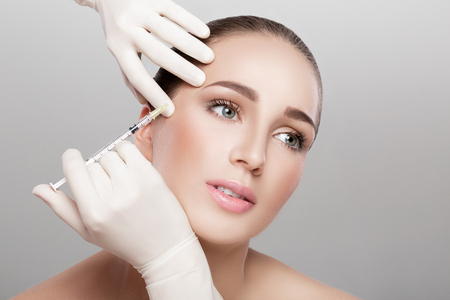 beautiful woman getting injectionの写真素材