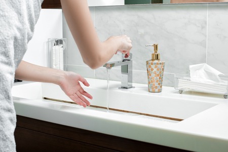 woman is washed clean water in the bathroom