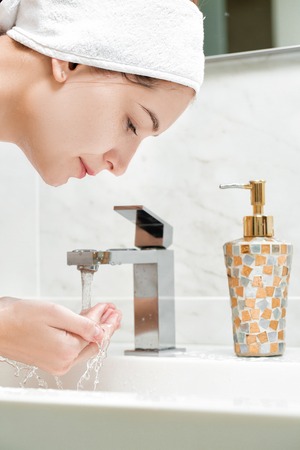 attractive woman to wash in bathroomの写真素材