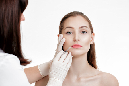 woman getting injection on lips.の写真素材