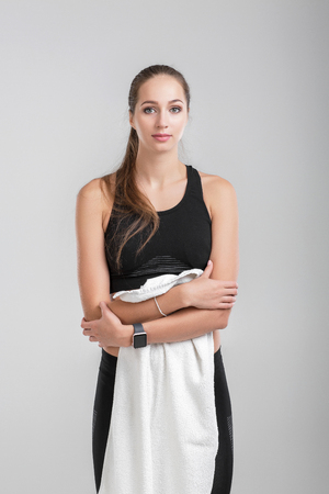 woman with a towel after a workoutの写真素材