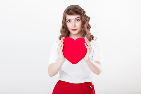 woman holding red heartの写真素材