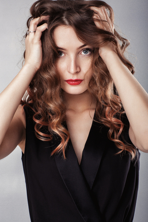 frustrated beautiful woman in blackの写真素材