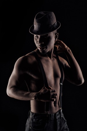 afro-american man in hat and suspendersの写真素材