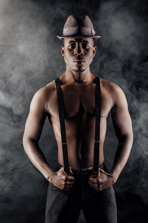 afro-american man in hat and suspendersの写真素材