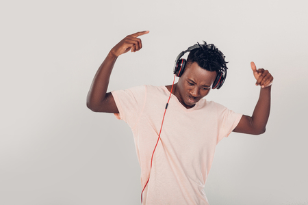 African-American man in headphones listening to musicの写真素材