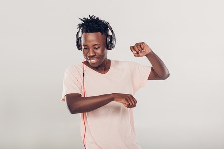 African-American man in headphones listening to musicの写真素材