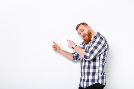 man with beard pointing copy space.の写真素材