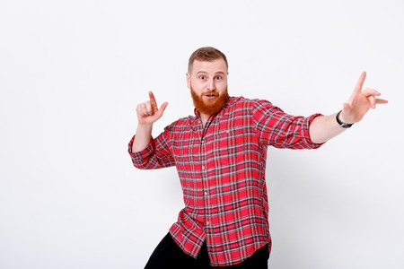 man with red hair and beard in plaid shirtの写真素材